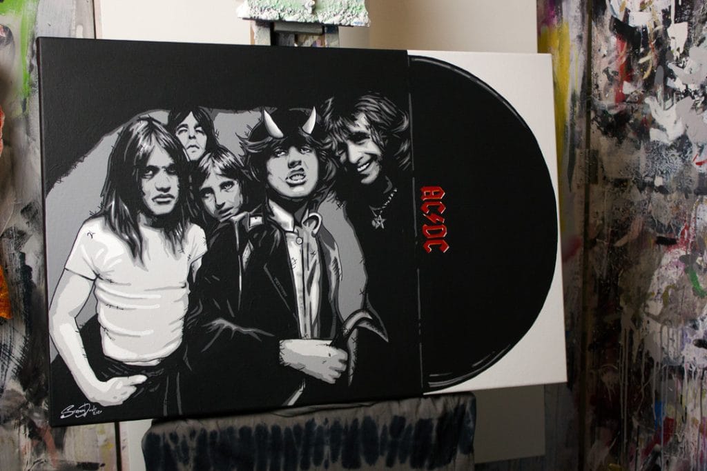 ac/dc pop art painting on a easel