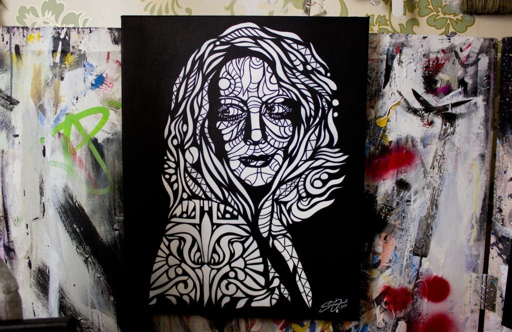 amy acker stencil painting in a art studio
