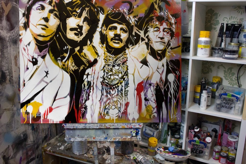 beatles spray painting on easel
