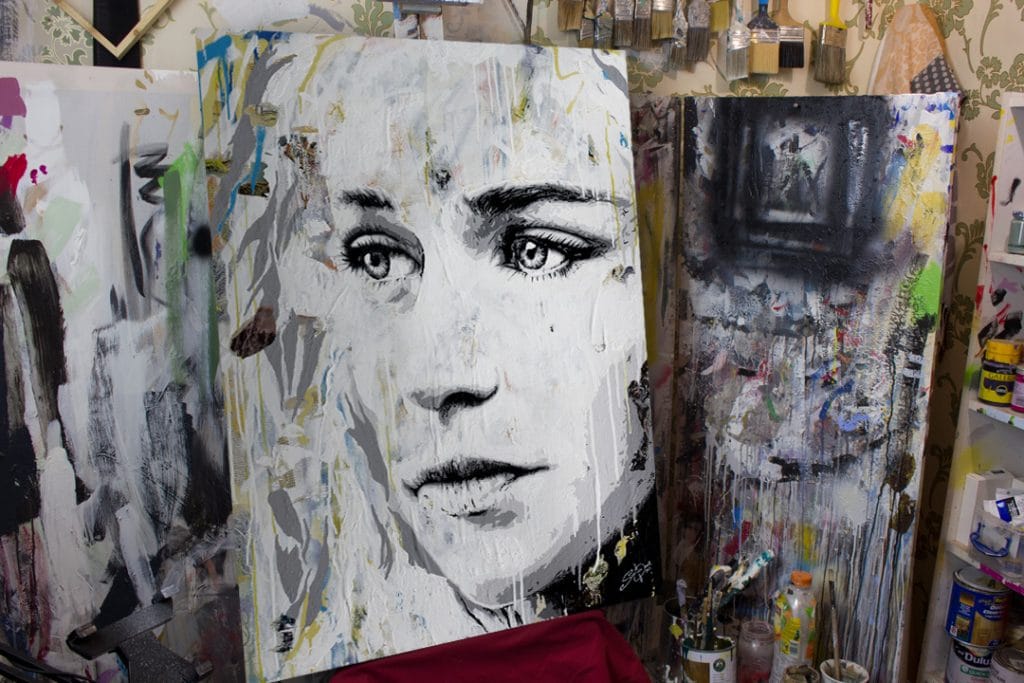 Daenerys Targaryen painting on a easel in a art studio