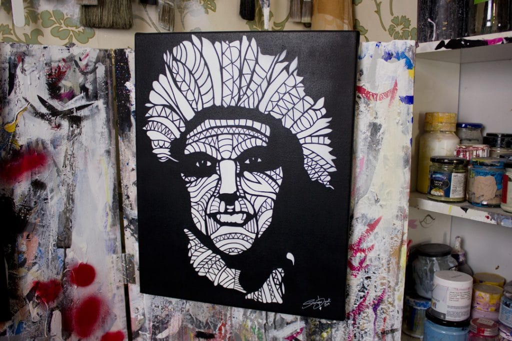intricate stencil painting in a art studio