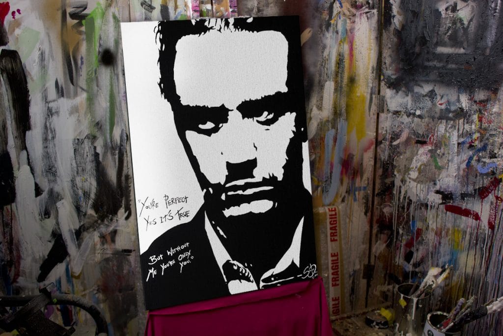 mike patton painting on easel in studio