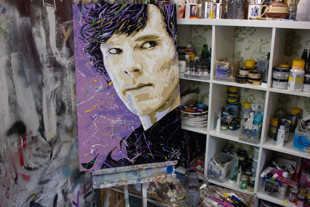 Benedict Cumberbatcha painting on a easel